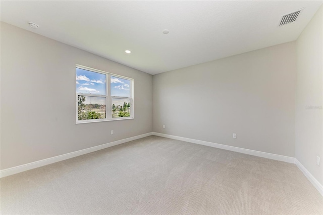 995 Waterline Ct, Sarasota, FL 34240 - unfurnished room featuring light colored carpet, visible vents, baseboards, and recessed lighting