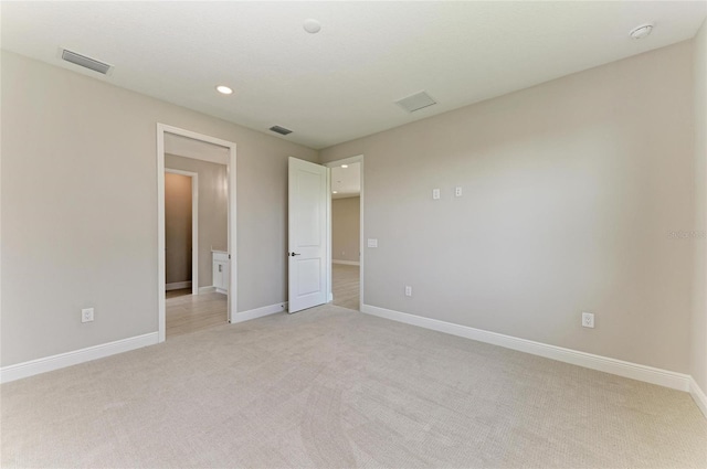 995 Waterline Ct, Sarasota, FL 34240 - unfurnished bedroom featuring light carpet, visible vents, and baseboards