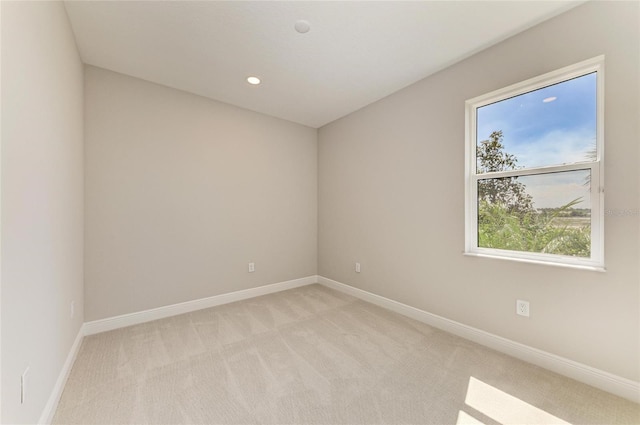 995 Waterline Ct, Sarasota, FL 34240 - spare room with recessed lighting, light colored carpet, and baseboards