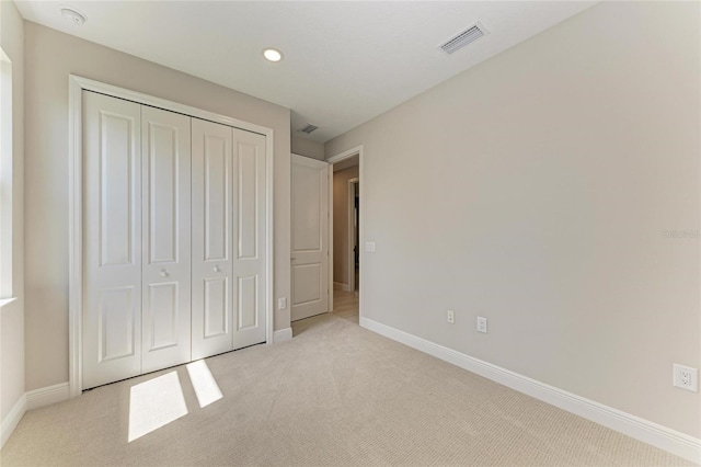 995 Waterline Ct, Sarasota, FL 34240 - unfurnished bedroom with light carpet, baseboards, and visible vents
