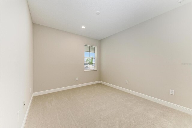 995 Waterline Ct, Sarasota, FL 34240 - unfurnished room with recessed lighting, light carpet, and baseboards