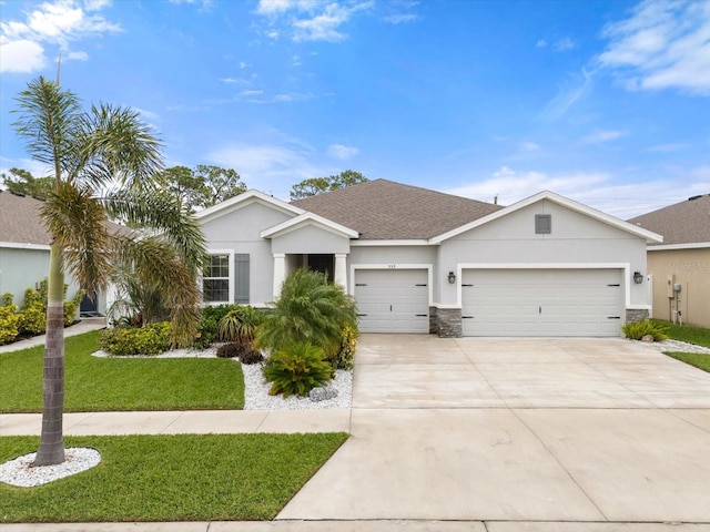 ranch-style house featuring a garage, a shingled roof, driveway, stucco siding, and a front lawn