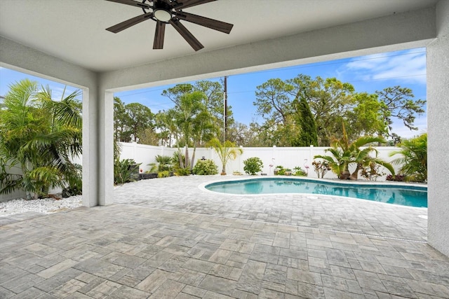 view of pool with a patio area, a fenced backyard, ceiling fan, and a fenced in pool