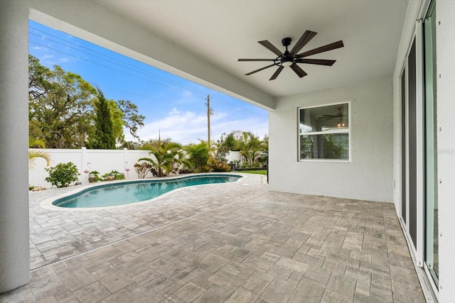 view of swimming pool featuring a ceiling fan, a fenced in pool, a fenced backyard, and a patio