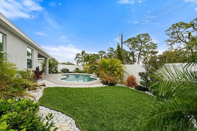 view of yard with a fenced in pool, a fenced backyard, and a patio