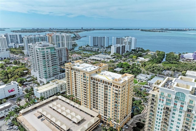 drone / aerial view featuring a water view and a view of city