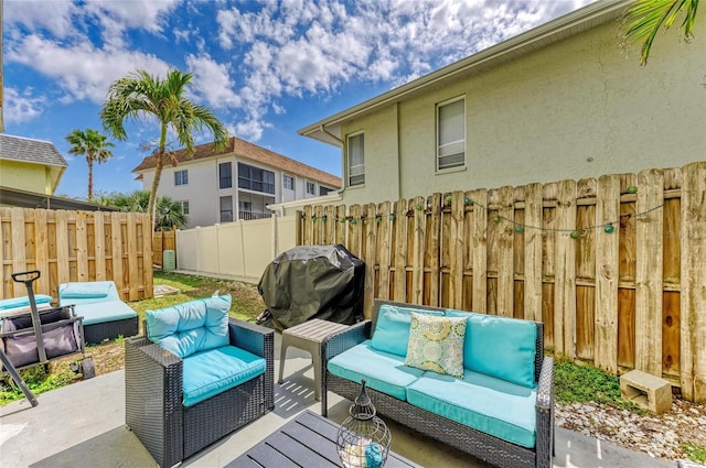 view of patio / terrace with an outdoor hangout area, grilling area, and fence