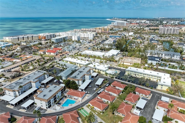 birds eye view of property featuring a view of city and a water view