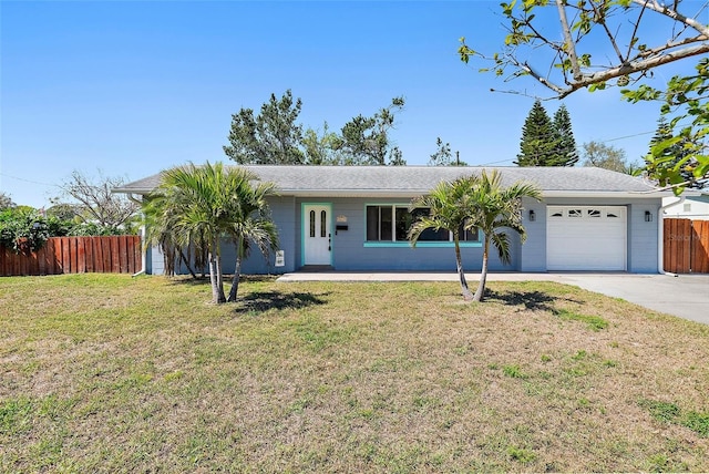 single story home with a front lawn, fence, a garage, and driveway