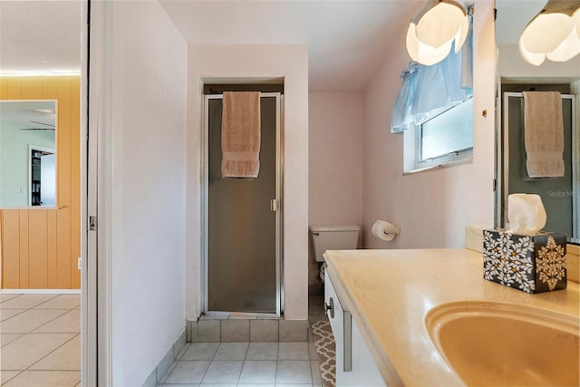 bathroom with vanity, a stall shower, and tile patterned flooring