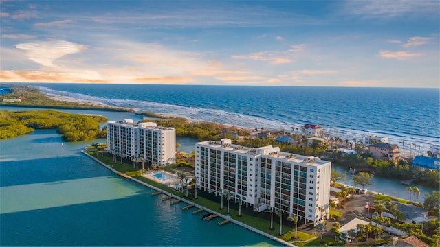 aerial view at dusk with a water view