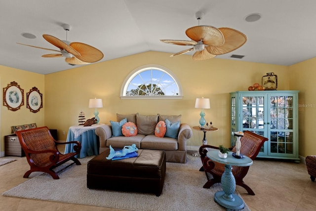 living room featuring tile patterned flooring, vaulted ceiling, a ceiling fan, and visible vents