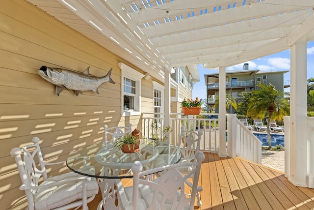 wooden deck featuring a pergola