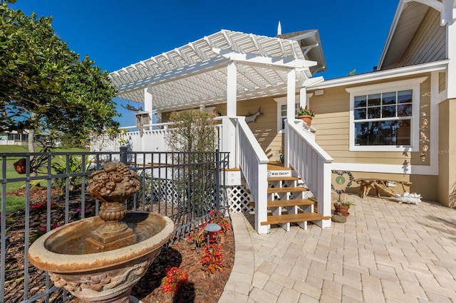 view of patio featuring fence and a pergola