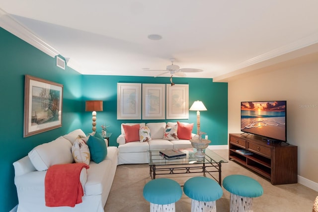 living room featuring visible vents, baseboards, a ceiling fan, and crown molding