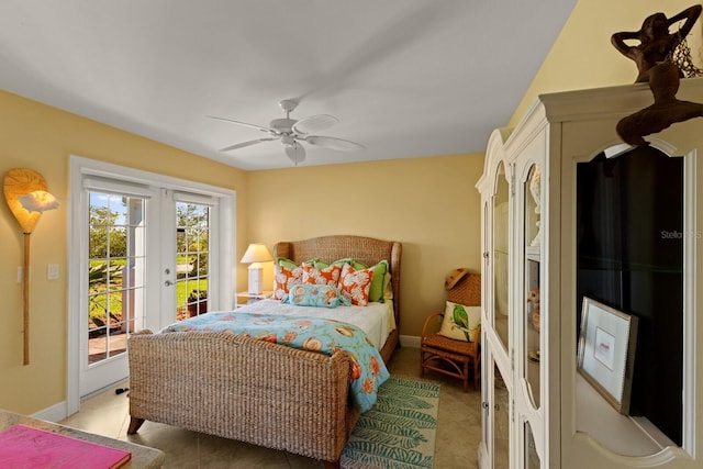 bedroom featuring light tile patterned floors, french doors, baseboards, and access to exterior