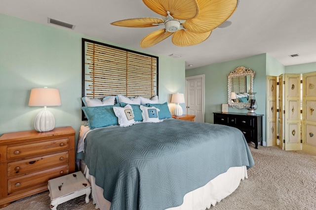 bedroom with visible vents, carpet floors, and ceiling fan