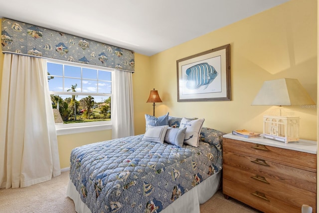 carpeted bedroom featuring baseboards