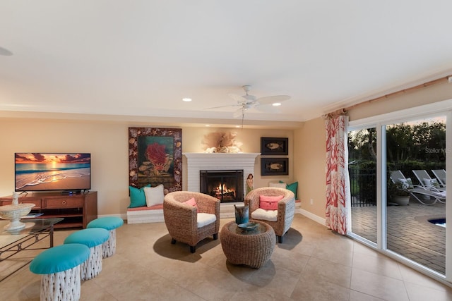 interior space with tile patterned flooring, a brick fireplace, baseboards, recessed lighting, and a ceiling fan