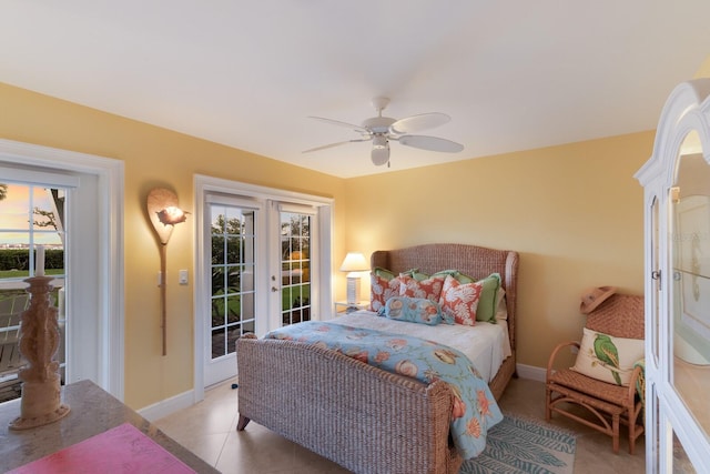 bedroom with light tile patterned floors, baseboards, ceiling fan, access to exterior, and french doors