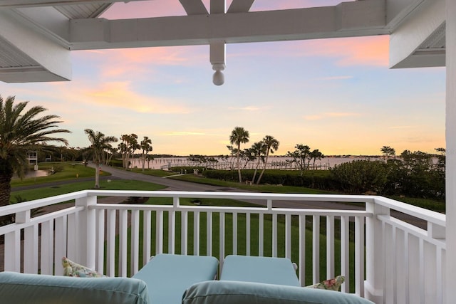 view of balcony at dusk