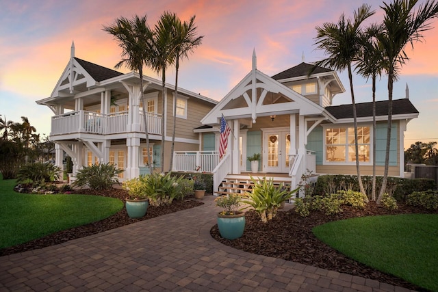 view of front of property with a porch and french doors