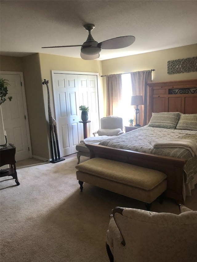 bedroom with light colored carpet and ceiling fan