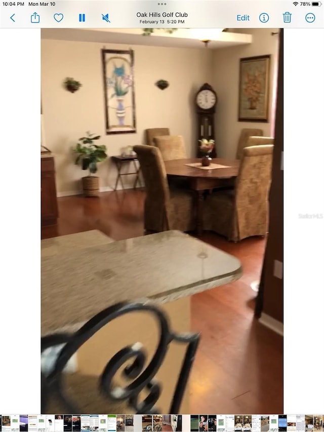 dining room featuring baseboards and wood finished floors