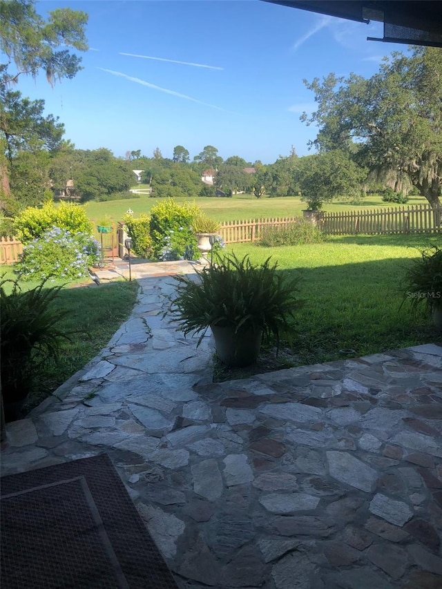 view of patio / terrace featuring fence