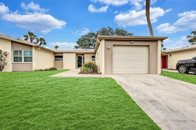 single story home featuring concrete driveway, a garage, a front yard, and stucco siding