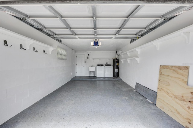 garage with concrete block wall, a sink, electric water heater, a garage door opener, and washer and clothes dryer