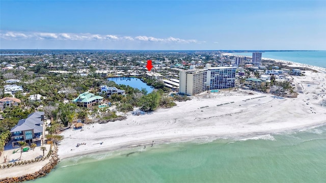 birds eye view of property with a city view, a beach view, and a water view