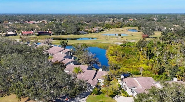 aerial view featuring a water view and a forest view