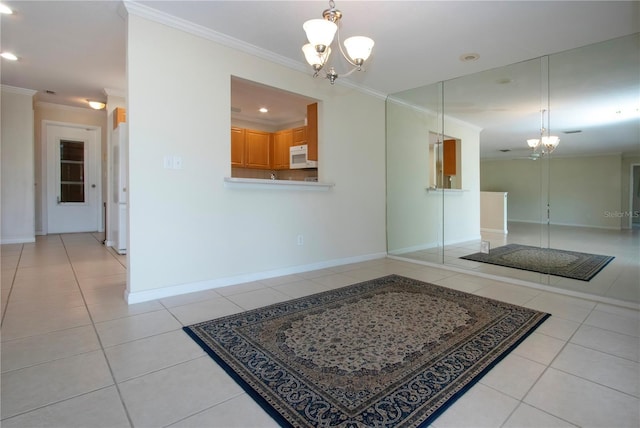 5621 Palm Aire Dr, Sarasota, FL 34243 - interior space featuring a chandelier, light tile patterned flooring, and crown molding