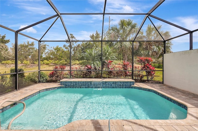 outdoor pool featuring a lanai and a patio area