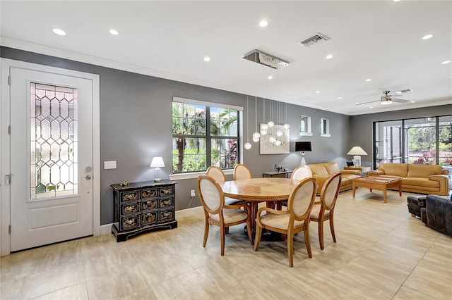 dining room featuring ornamental molding, plenty of natural light, visible vents, and recessed lighting