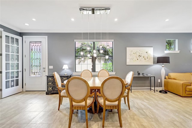 dining room featuring ornamental molding, recessed lighting, and baseboards