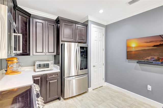 kitchen with dark brown cabinets, stainless steel appliances, and light countertops