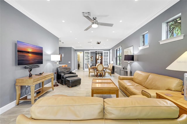 living room featuring recessed lighting, a ceiling fan, baseboards, visible vents, and crown molding