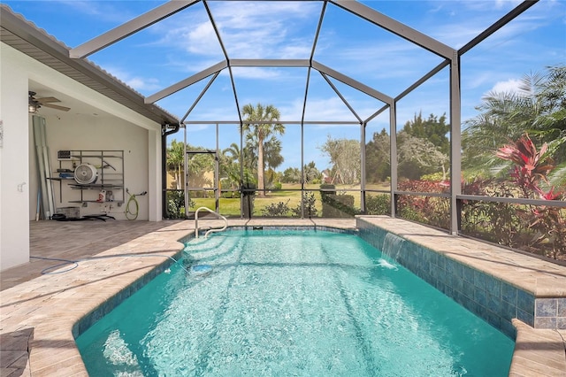 outdoor pool with glass enclosure and a patio area