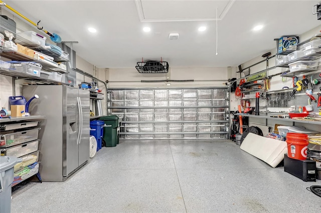 garage with stainless steel fridge with ice dispenser