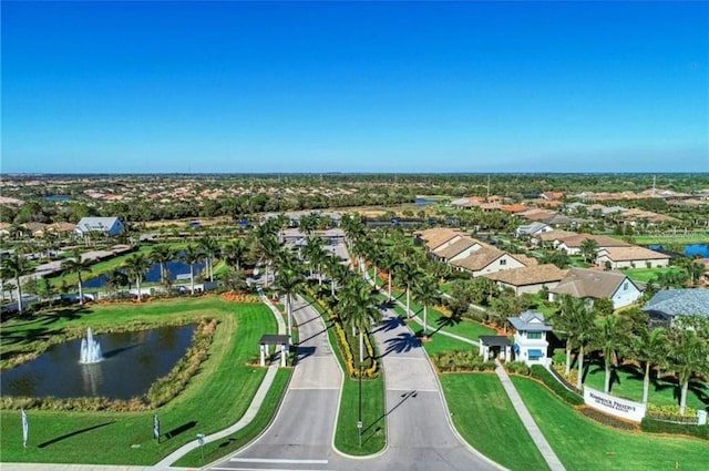 drone / aerial view featuring a residential view and a water view