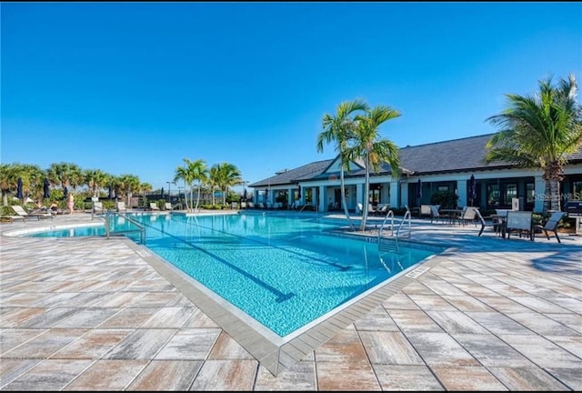 pool with a patio area