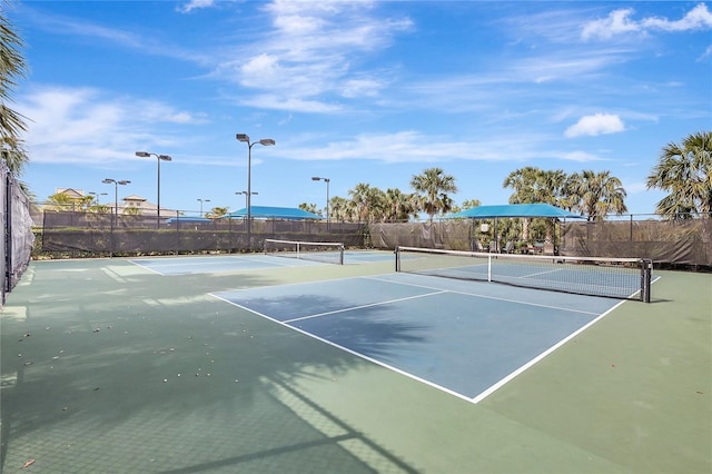 view of sport court with fence