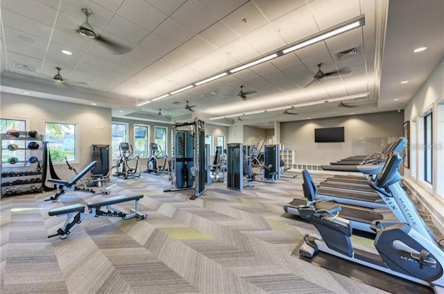 exercise room featuring ceiling fan, recessed lighting, visible vents, and light colored carpet