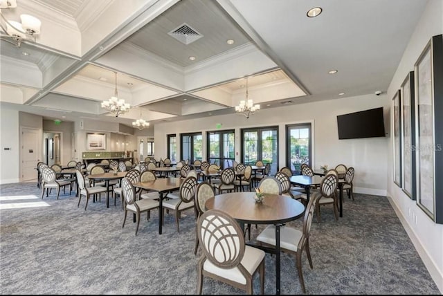 dining room with a chandelier, carpet, visible vents, and crown molding