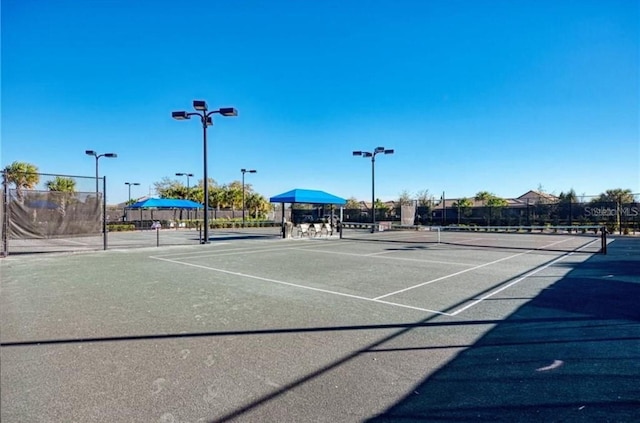 view of sport court with fence