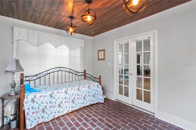 unfurnished bedroom featuring brick floor, wood ceiling, baseboards, and french doors