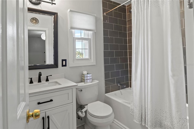 bathroom featuring toilet, shower / bath combination with curtain, and vanity