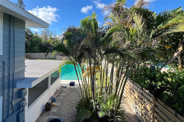 view of swimming pool featuring a fenced backyard and a fenced in pool